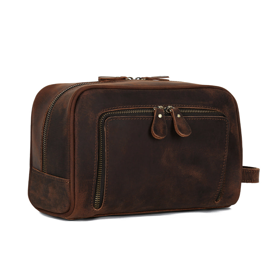 Dark brown distressed leather toiletry bag with a front zip pocket