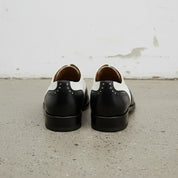 Handcrafted Men's Black and White Wingtip Dress Shoes