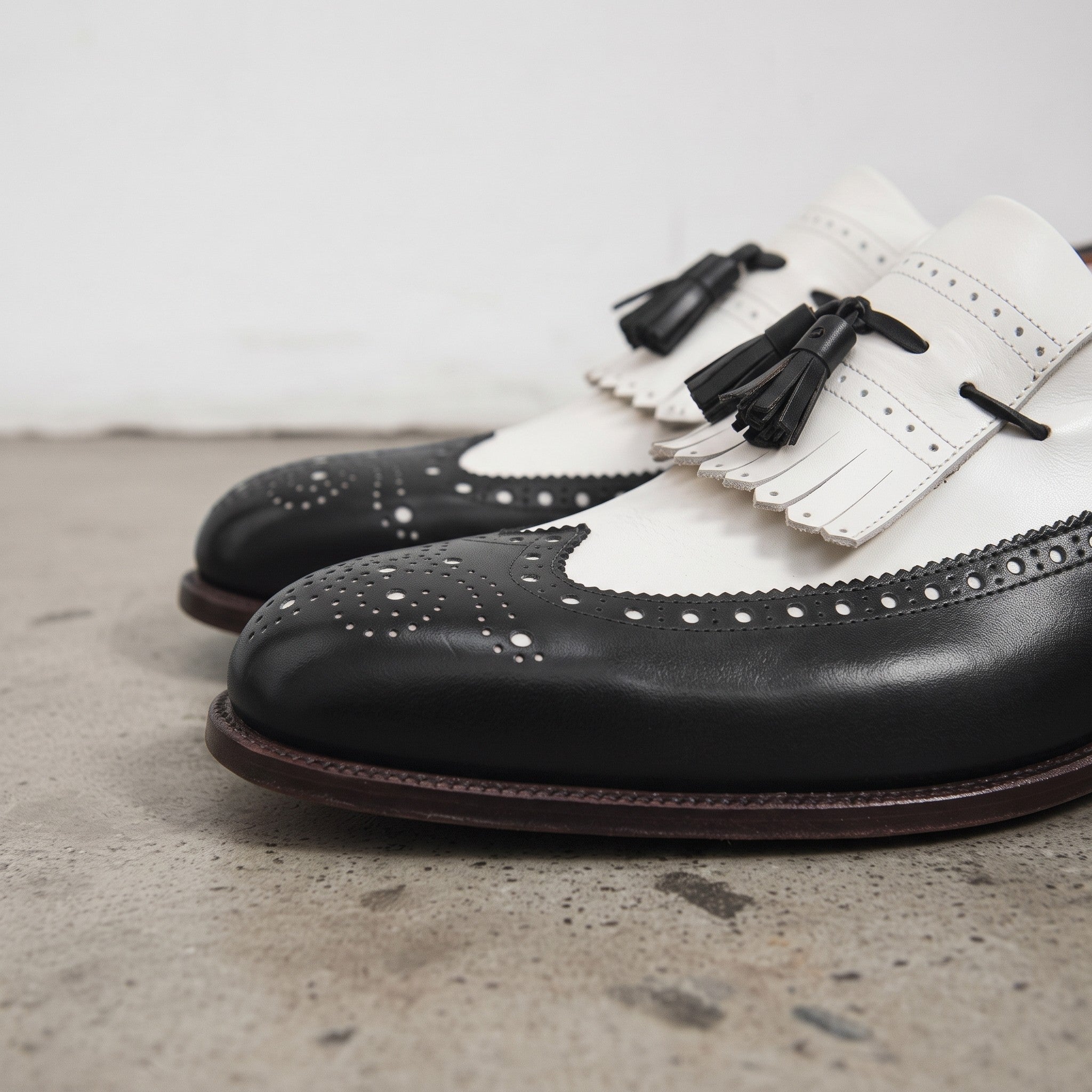 Men's Black and White Wingtip Leather Tassel Loafers — Rowe
