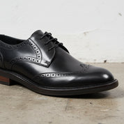 Handmade Men's Black & Brown Leather Wingtip Dress Shoes - detail-view-showing-texture