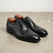 Handmade Mens Black Wingtip dress shoes, Men Black leather brogue shoes - angle-view-showing-depth
