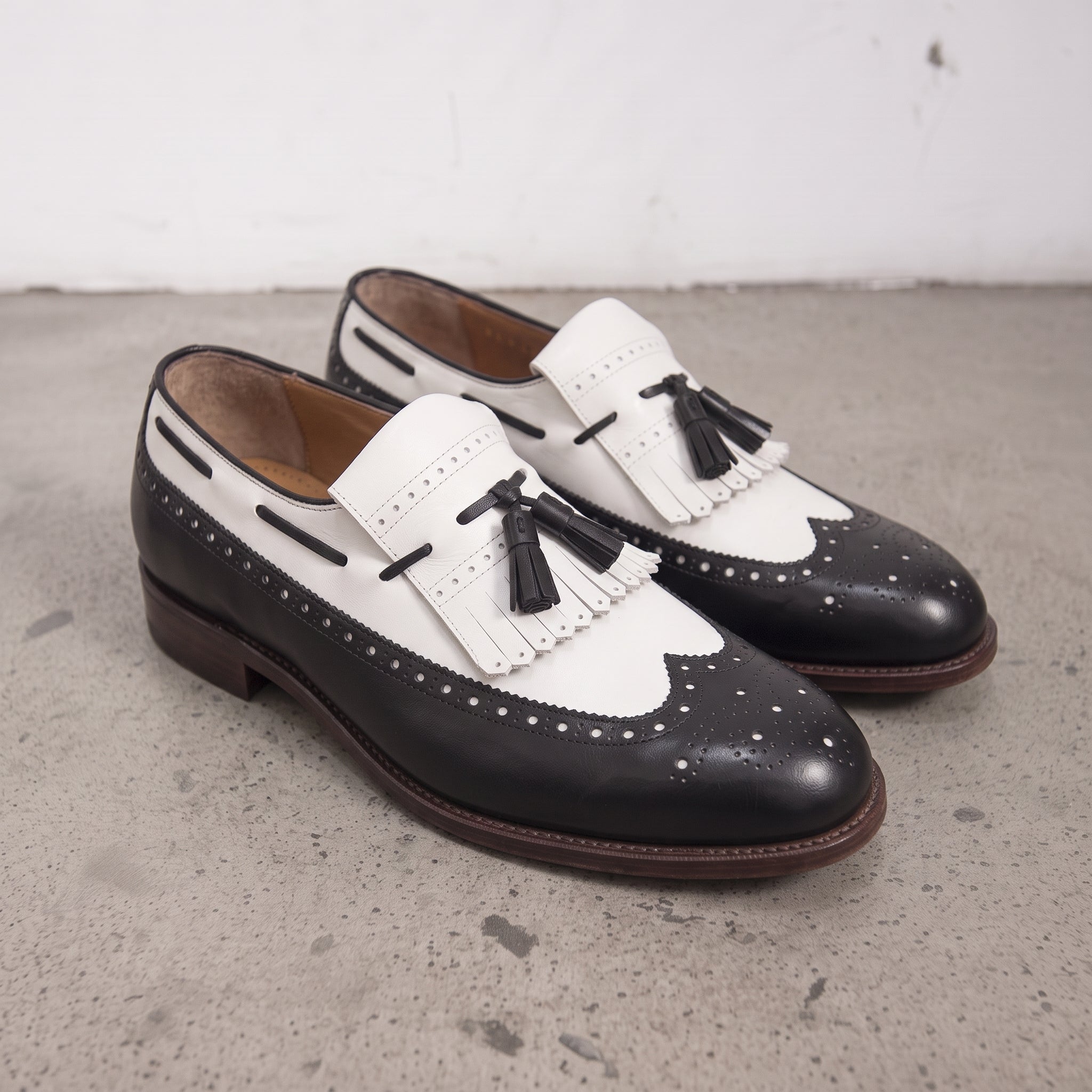 Men's Black and White Wingtip Leather Tassel Loafers — Rowe