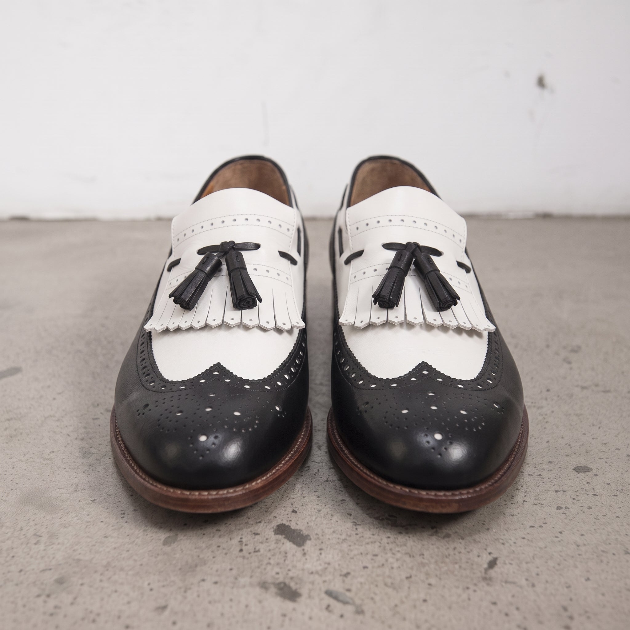 Men's Black and White Wingtip Leather Tassel Loafers — Rowe