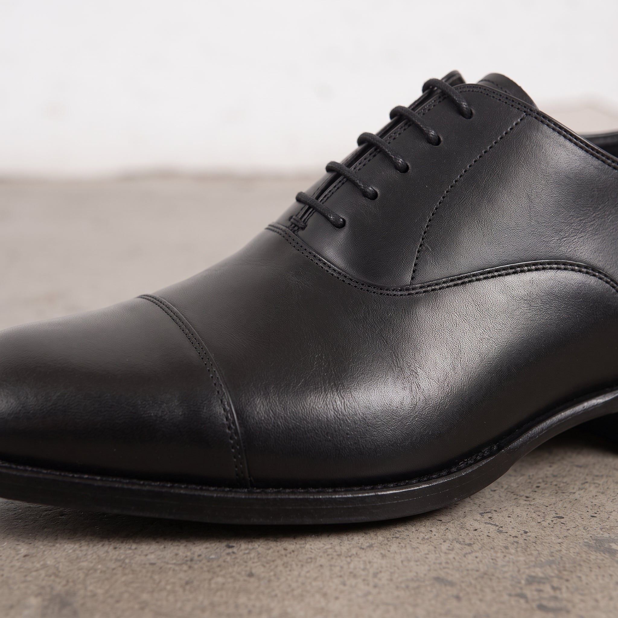 Men's Black Cap-Toe Leather Oxfords — Sotheby