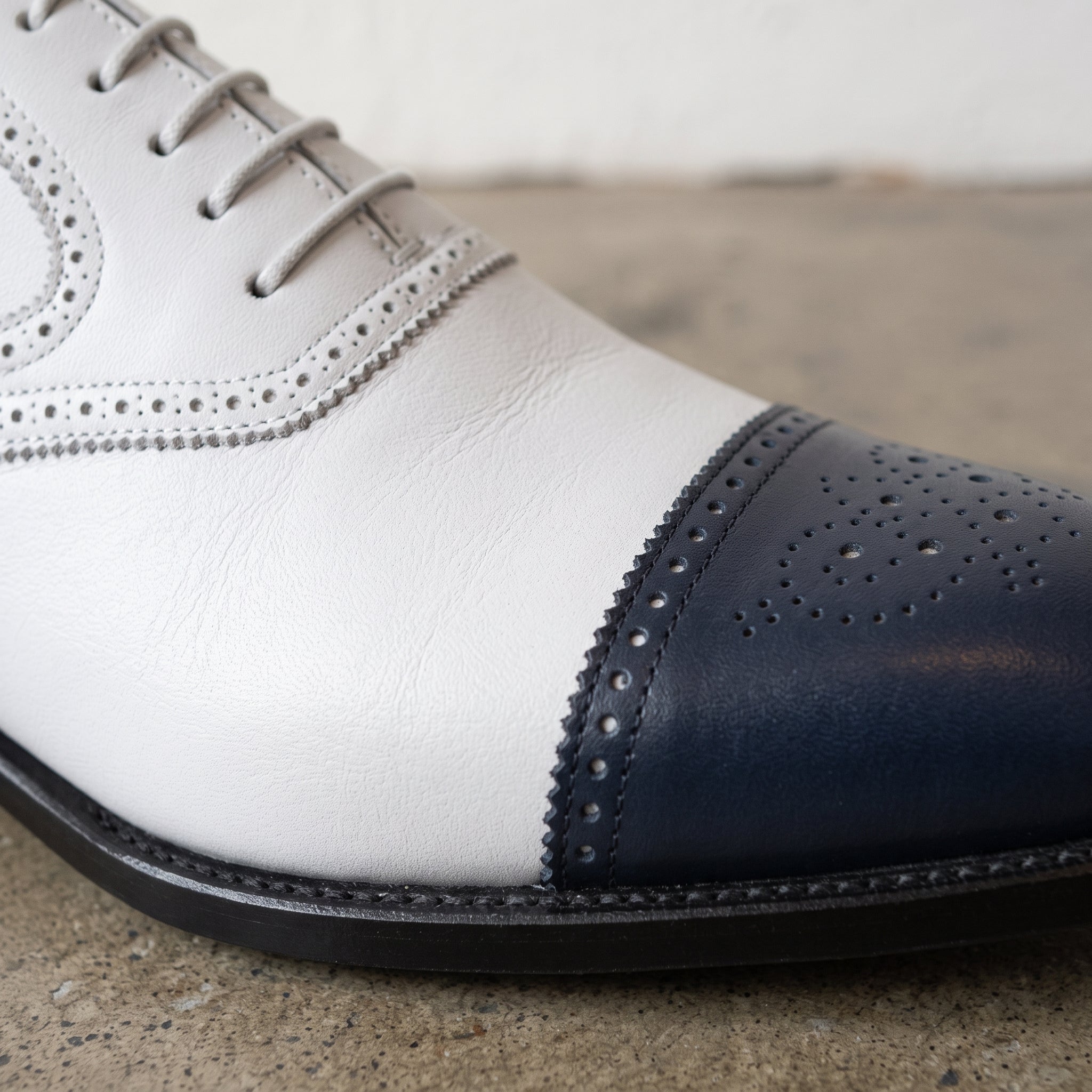 Men's White and Navy Cap-Toe Spectator Leather Oxfords — Craven