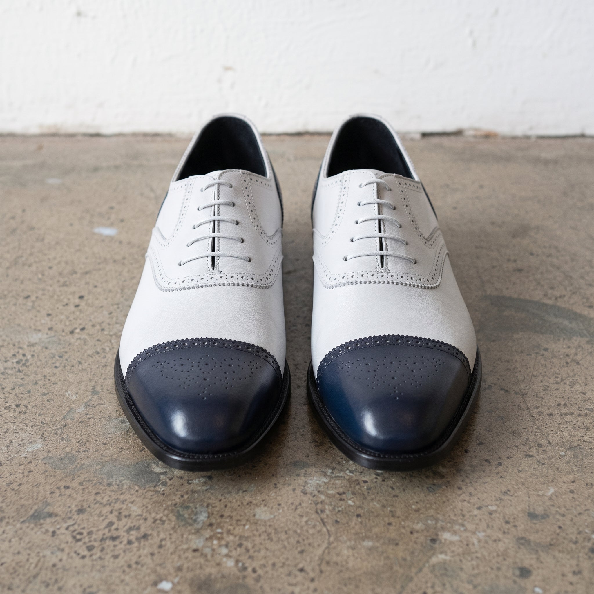 Men's White and Navy Cap-Toe Spectator Leather Oxfords — Craven